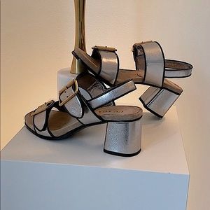Prada heeled silver sandals w/ gold buckle detail